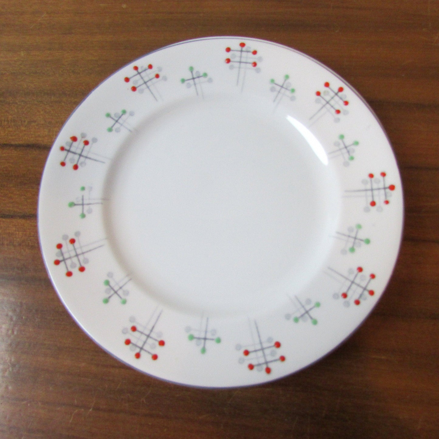 Four 1950s Vivace Roslyn hu-Era bone china side plates