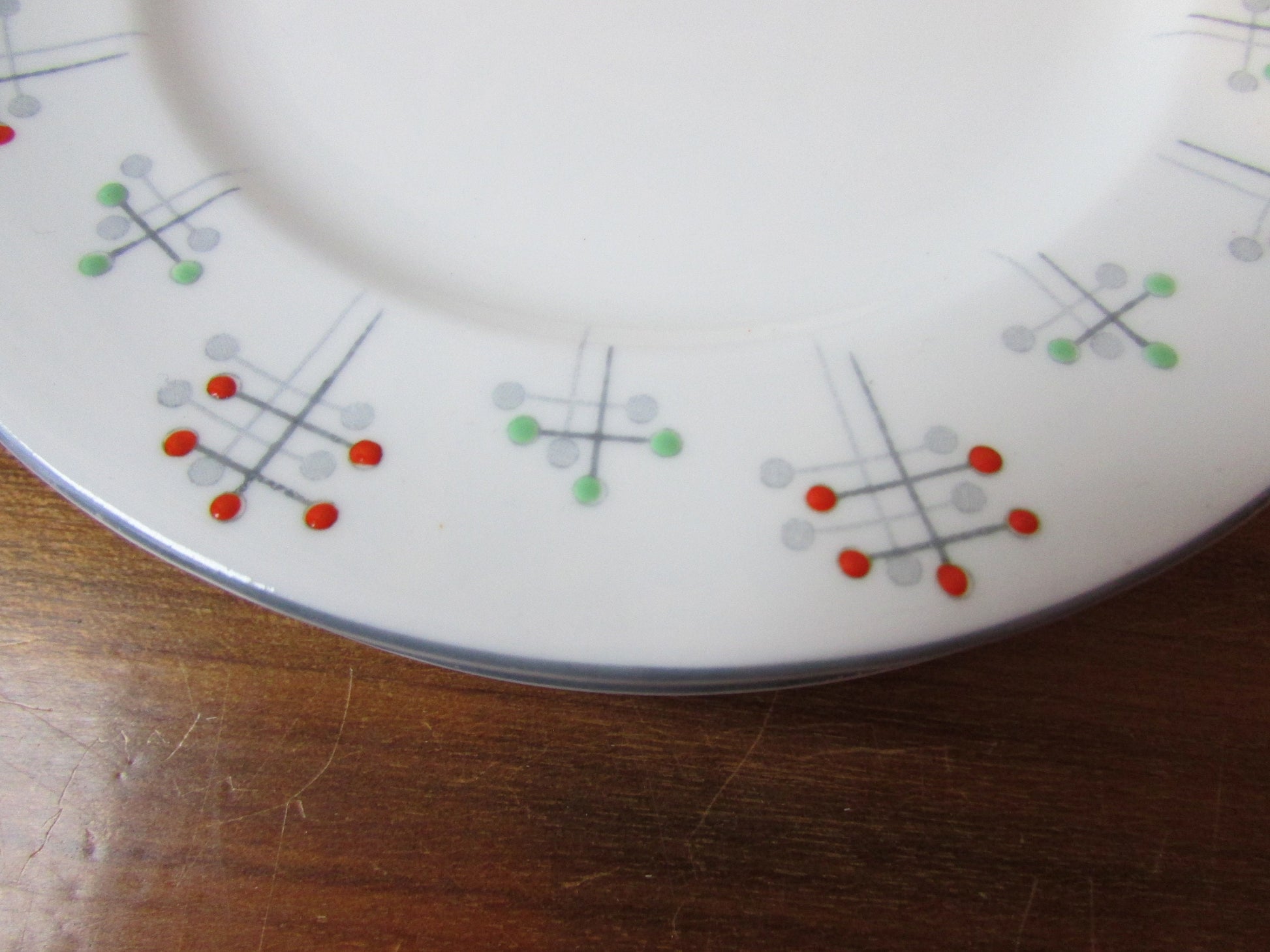 Four 1950s Vivace Roslyn hu-Era bone china side plates