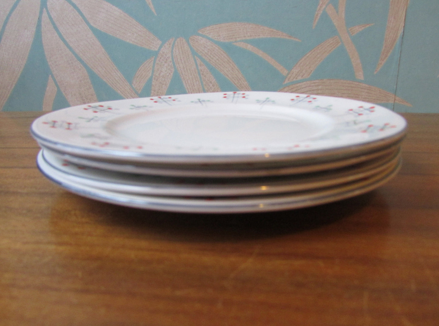 Four 1950s Vivace Roslyn hu-Era bone china side plates