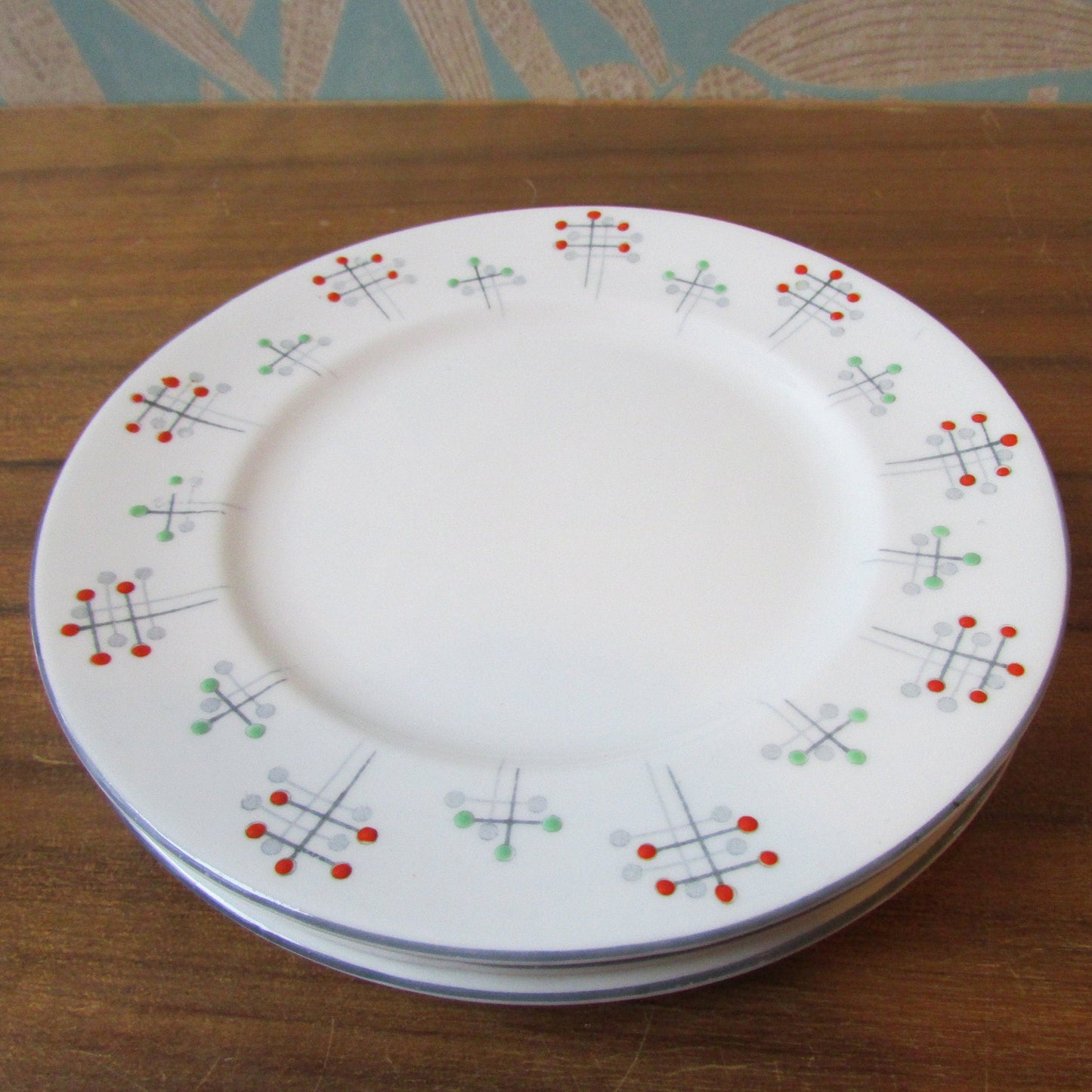 Four 1950s Vivace Roslyn hu-Era bone china side plates