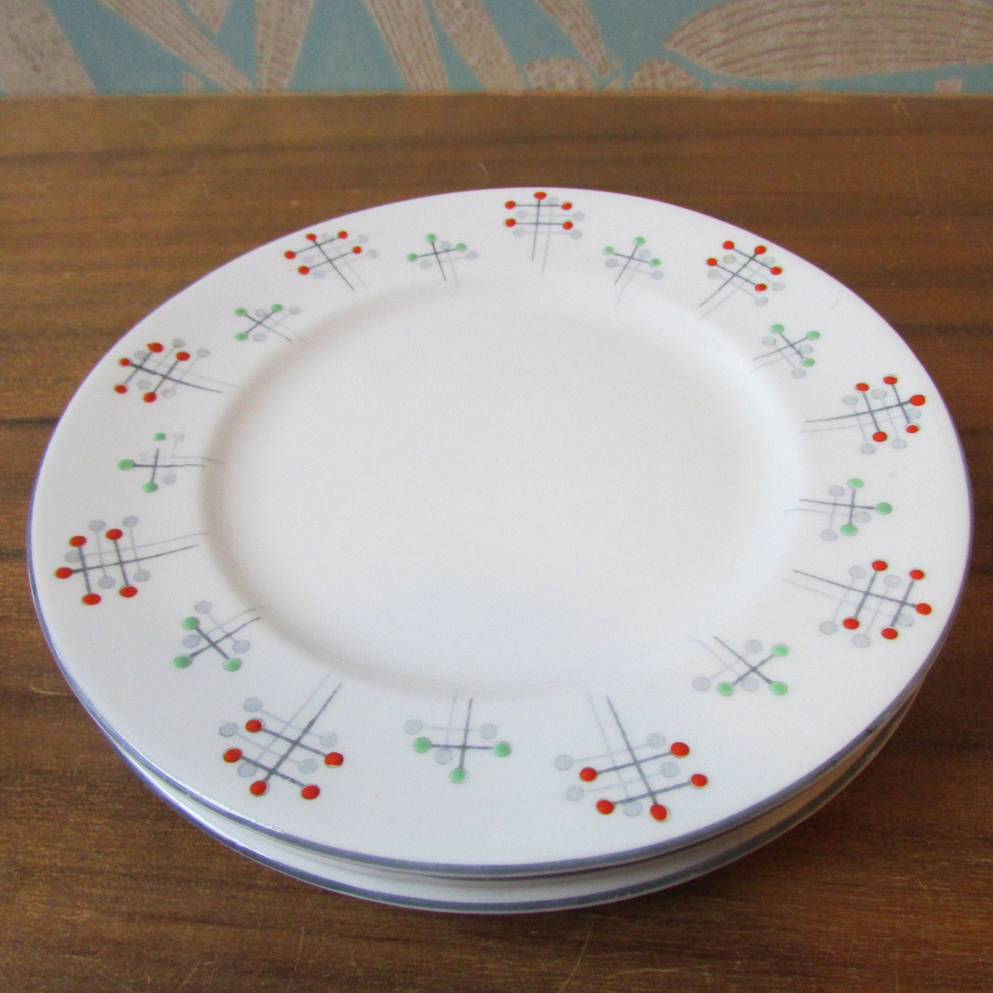 Four 1950s Vivace Roslyn hu-Era bone china side plates