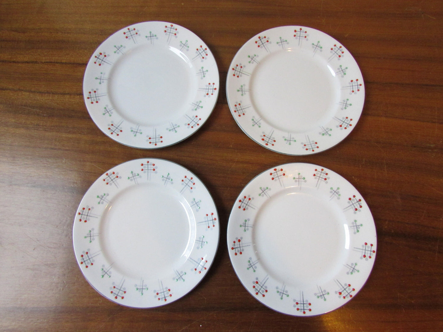 Four 1950s Vivace Roslyn hu-Era bone china side plates