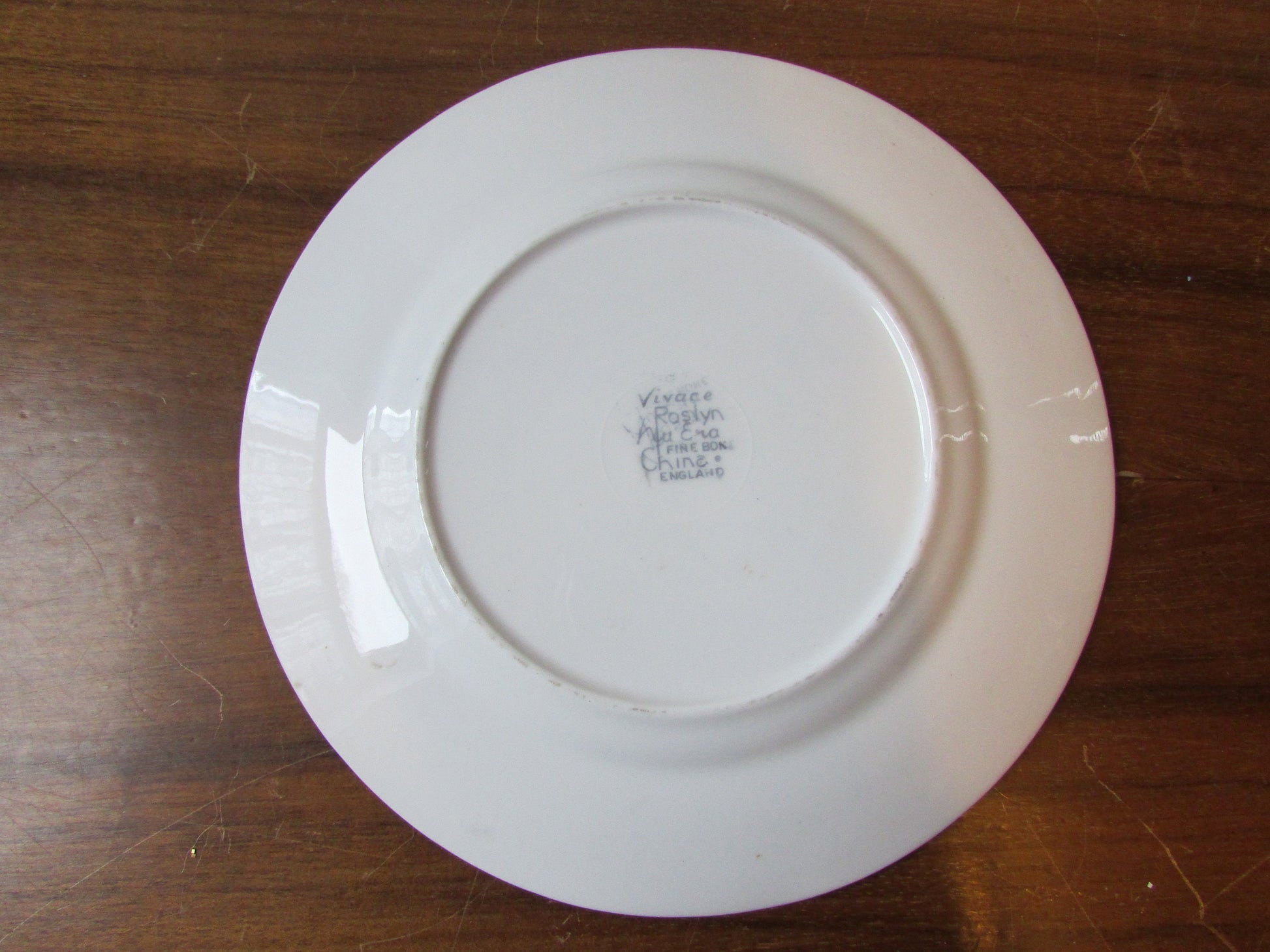 Four 1950s Vivace Roslyn hu-Era bone china side plates