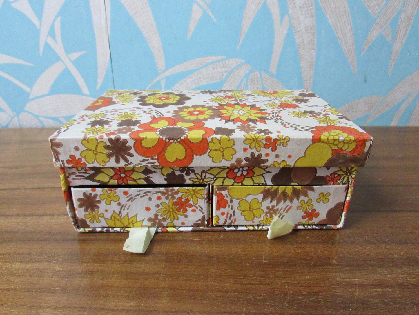 1960s floral patterned 2-drawer cardboard sewing box, with assorted vintage notions