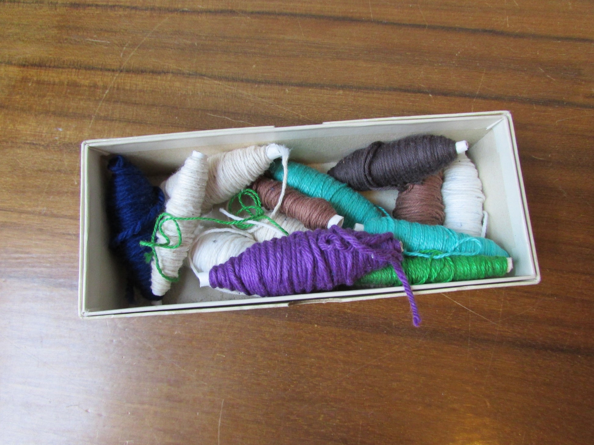 Vintage cardboard Londoner pipe box filled with assorted embroidery threads