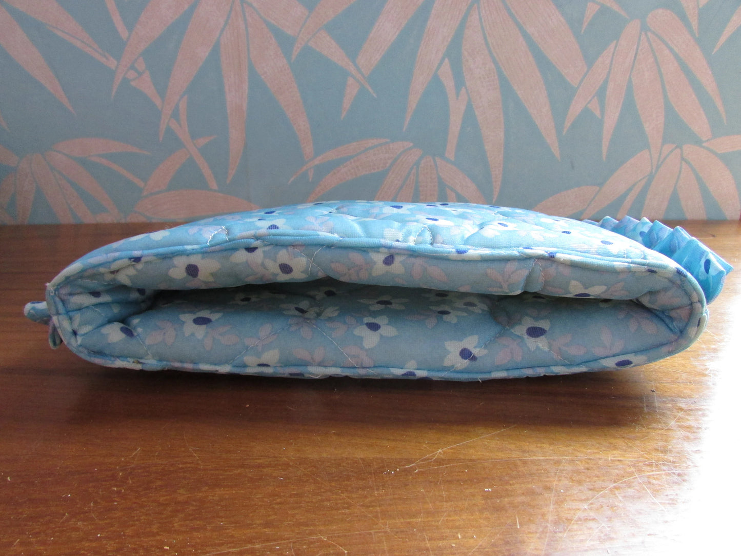 Vintage quilted blue floral tea cosy with ruffle edging