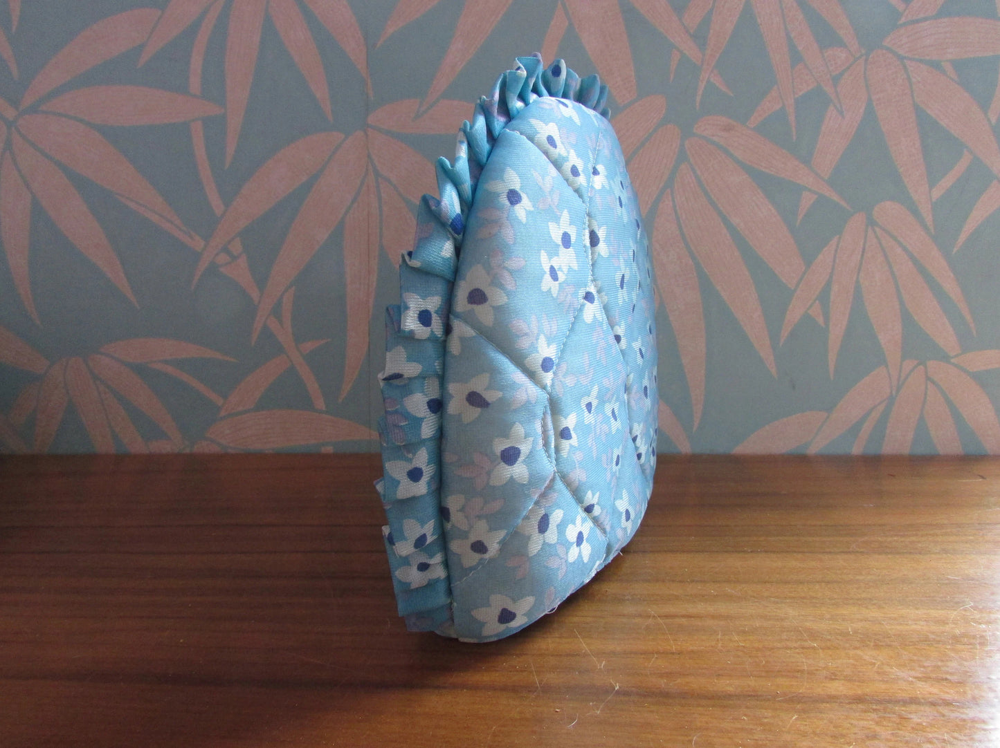 Vintage quilted blue floral tea cosy with ruffle edging