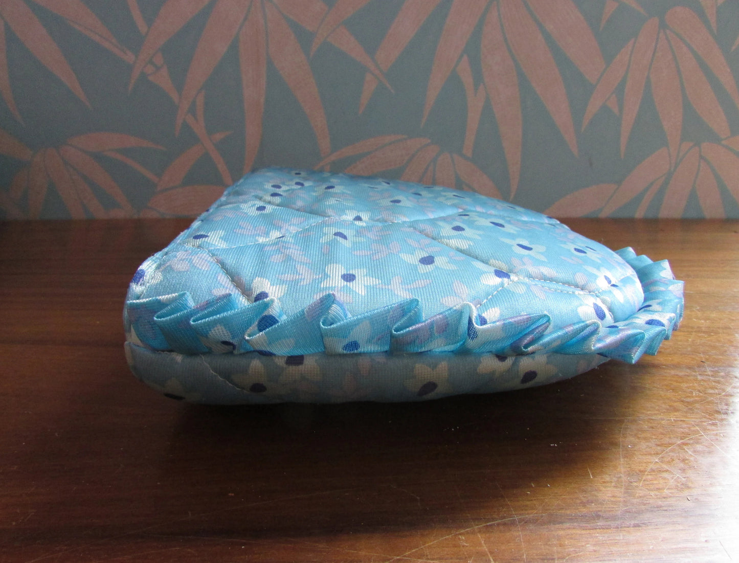 Vintage quilted blue floral tea cosy with ruffle edging