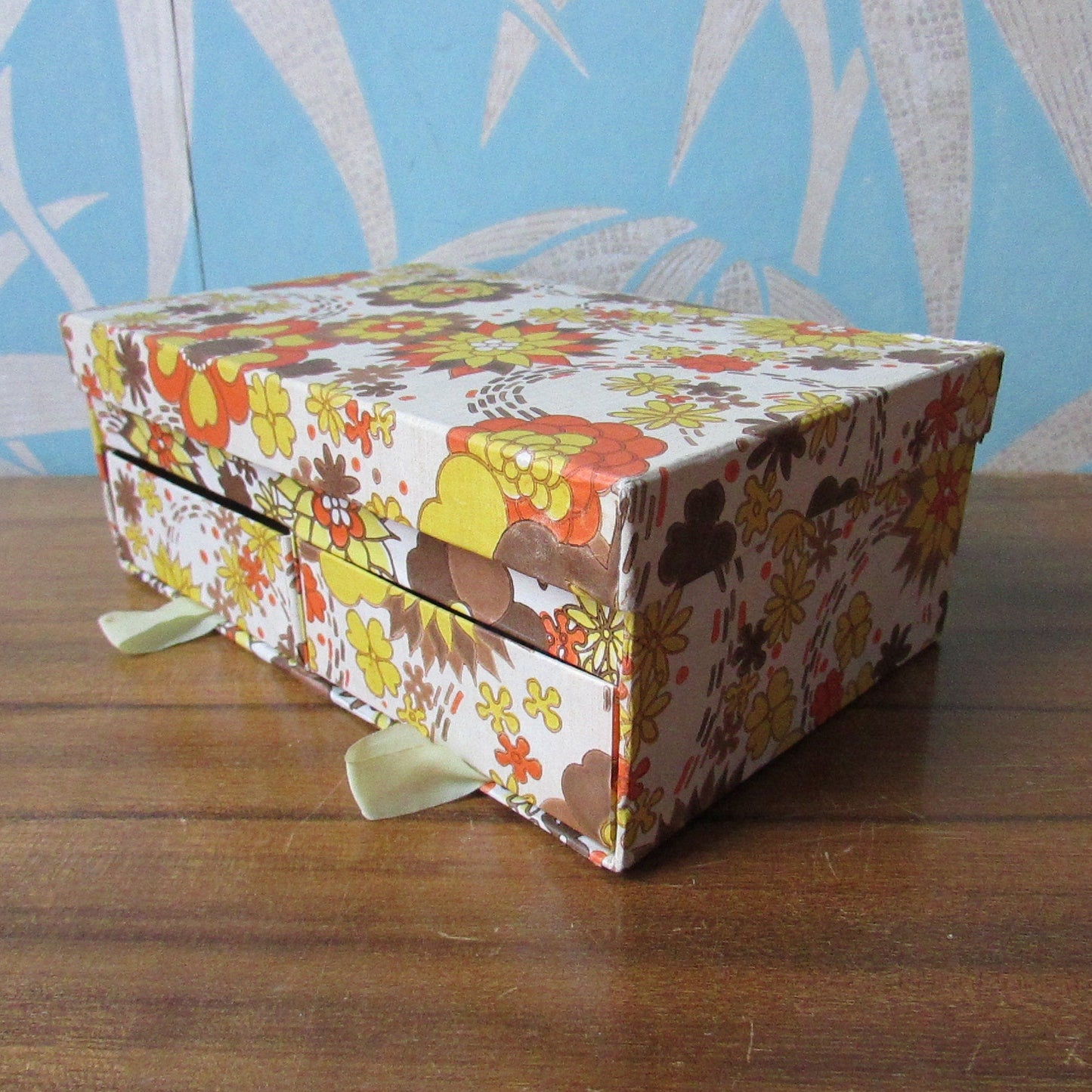 1960s floral patterned 2-drawer cardboard sewing box, with assorted vintage notions