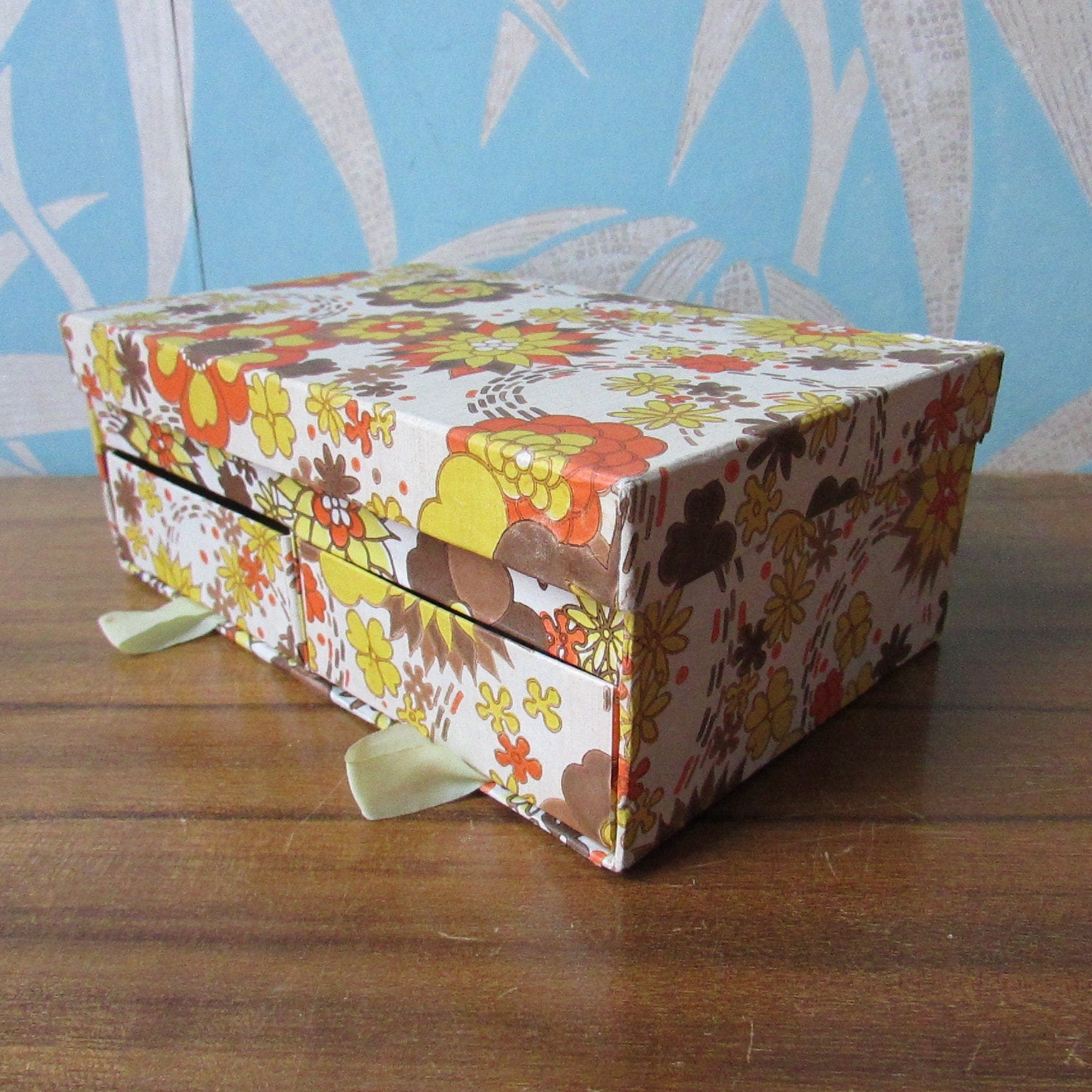 1960s floral patterned 2-drawer cardboard sewing box, with assorted vintage notions