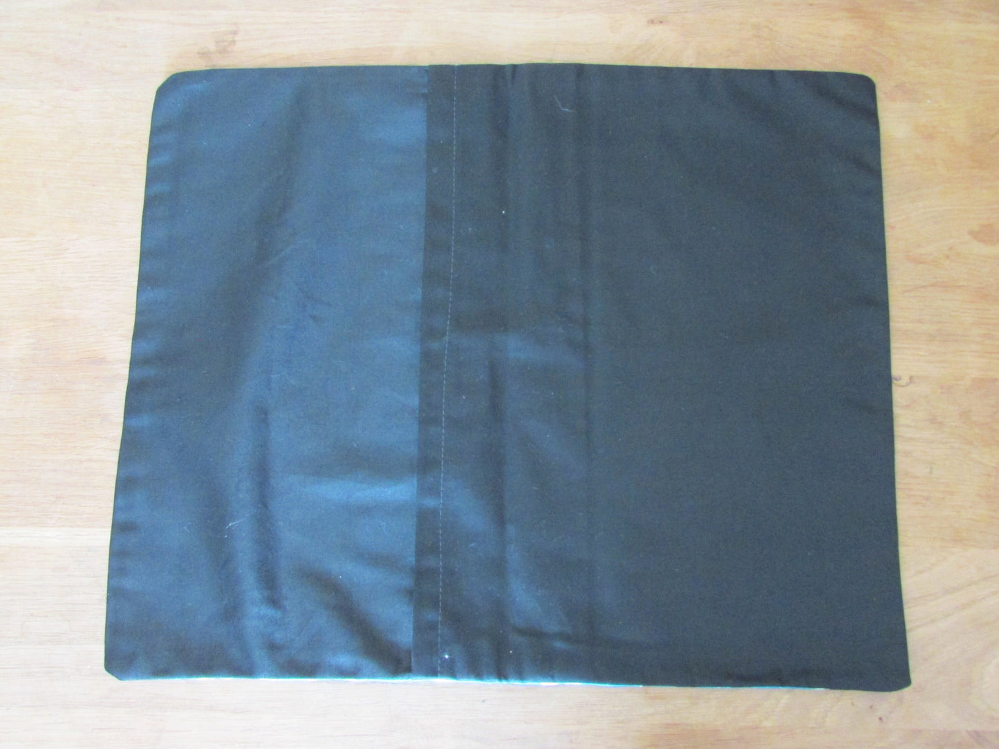 Home-made mid-century blue repeat rose cushion cover with contrast black reverse