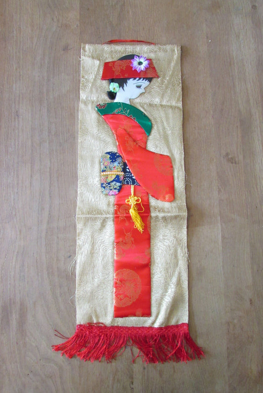 Vintage applique scroll wall hanging of Japanese geisha