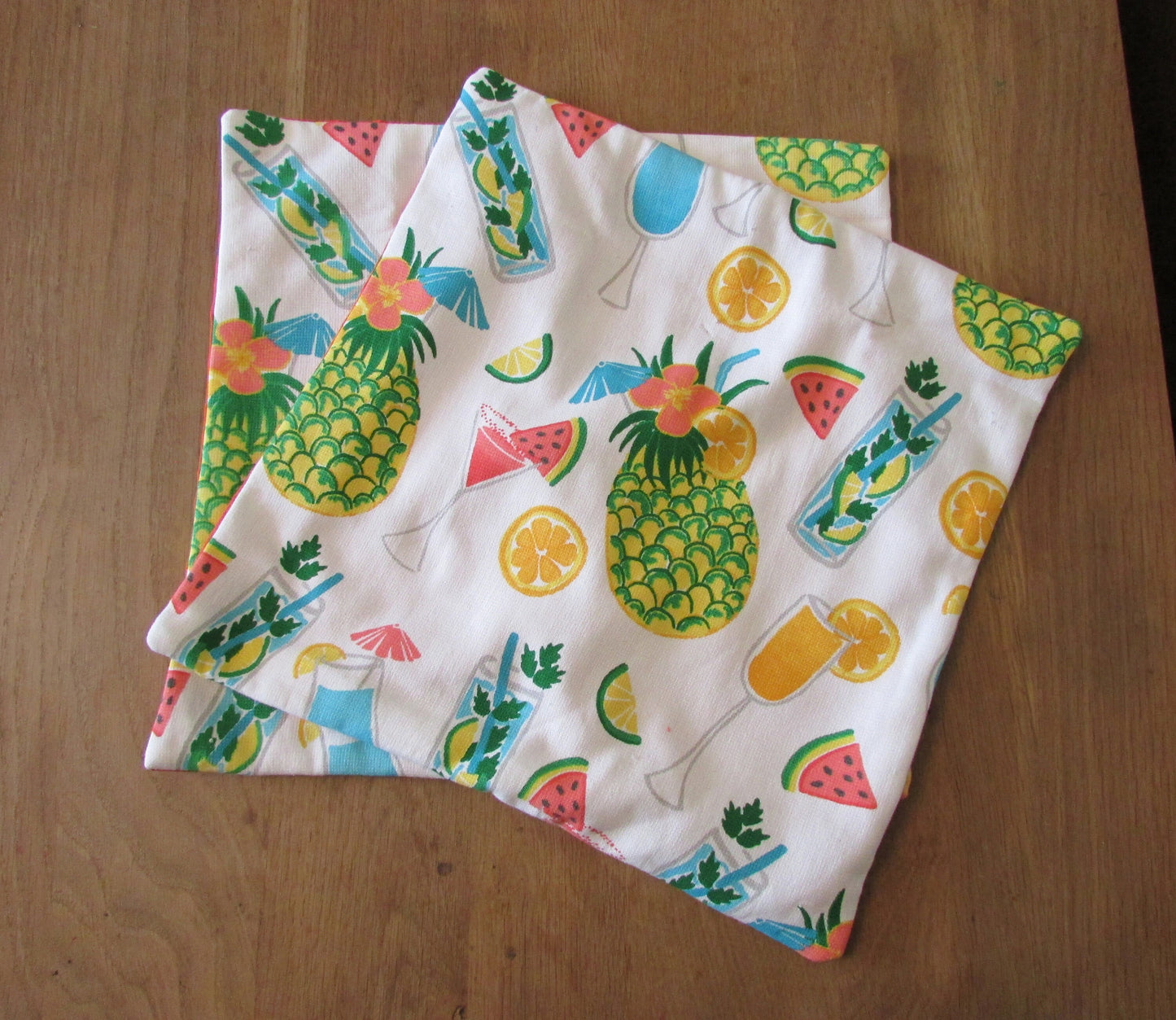 Home-made retro tropical cocktail print cushion cover with contrast orange reverse