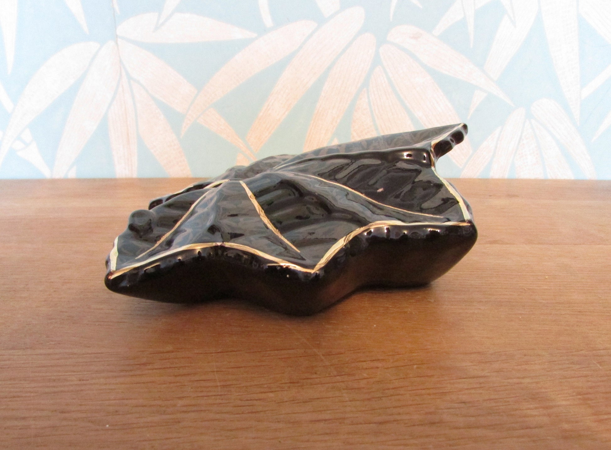 Vintage black & gold maple leaf wall pocket/vase, marked 22 carat gold