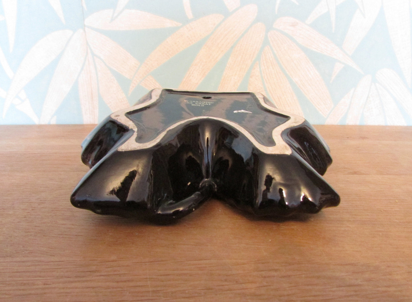 Vintage black & gold maple leaf wall pocket/vase, marked 22 carat gold