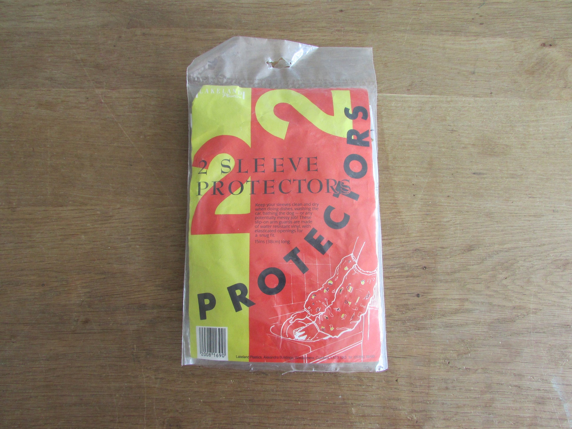 Pair of vintage Lakeland Plastics plastic sleeve protectors, 1950s style kitchen appliances/utensil print