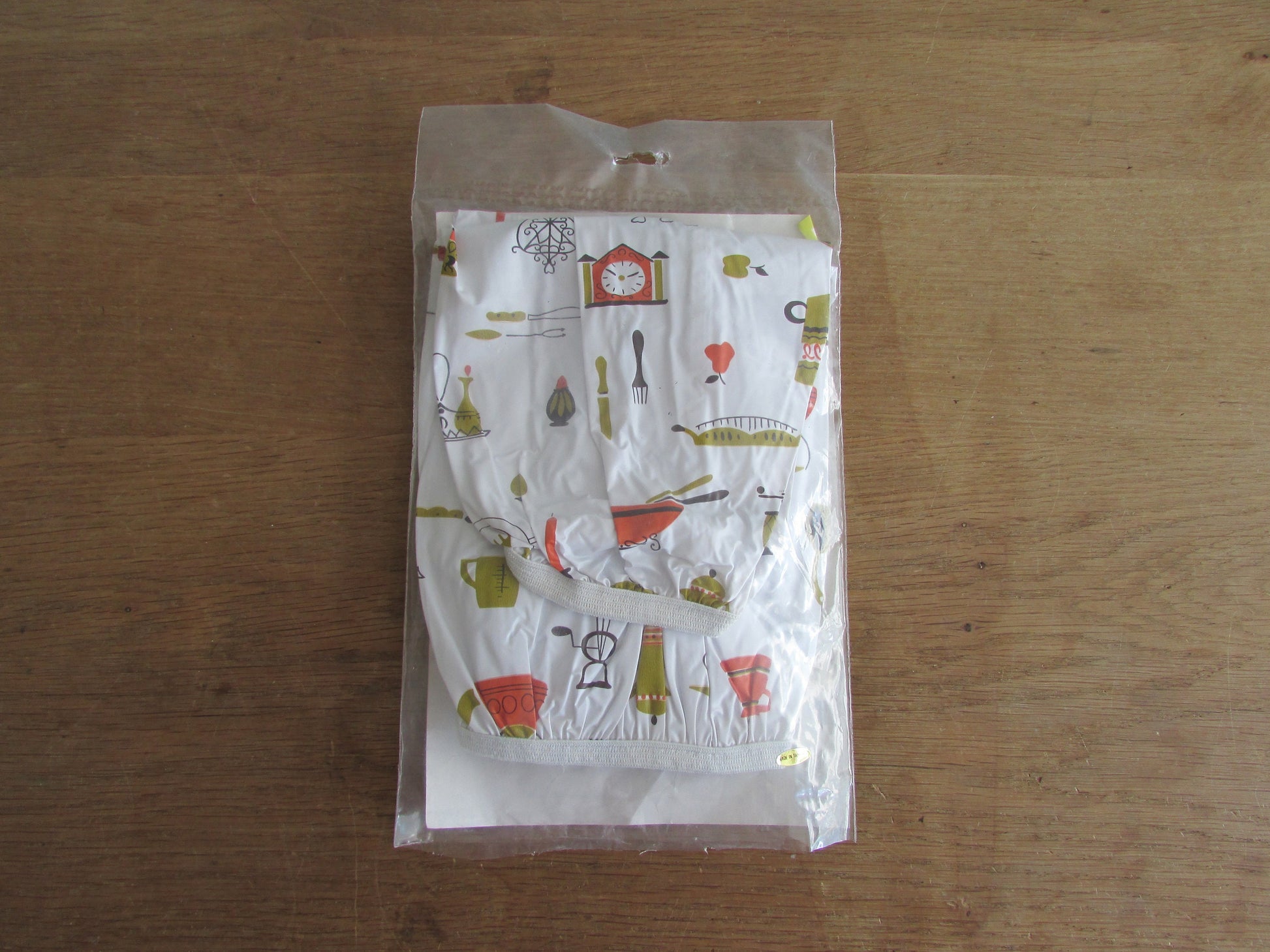 Pair of vintage Lakeland Plastics plastic sleeve protectors, 1950s style kitchen appliances/utensil print