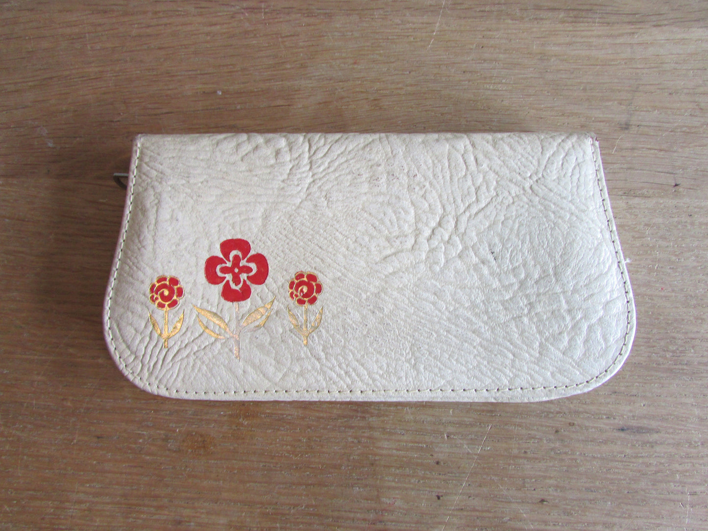 1950s manicure set in zipped leather travel case with red & gold flower detail