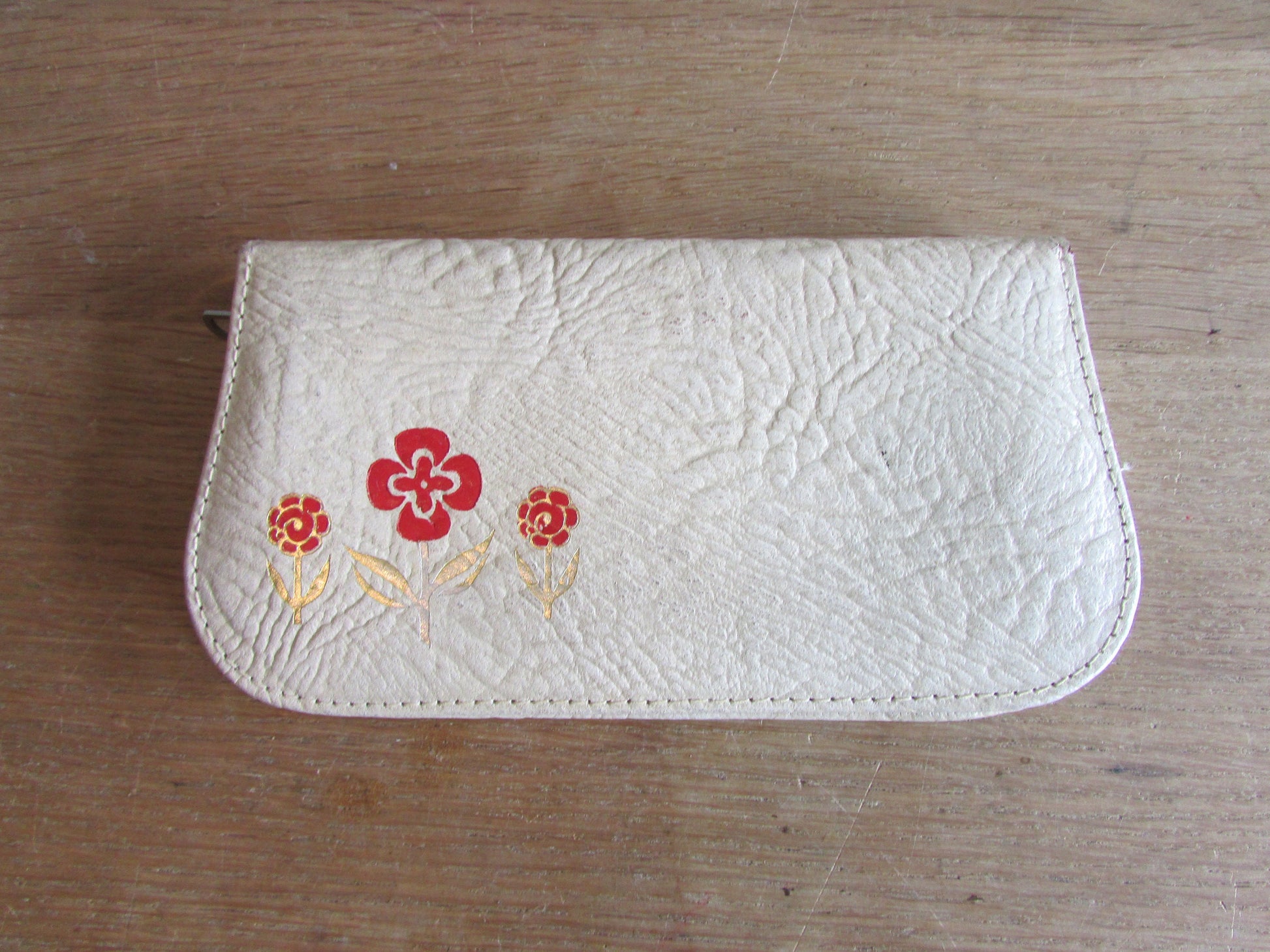 1950s manicure set in zipped leather travel case with red & gold flower detail