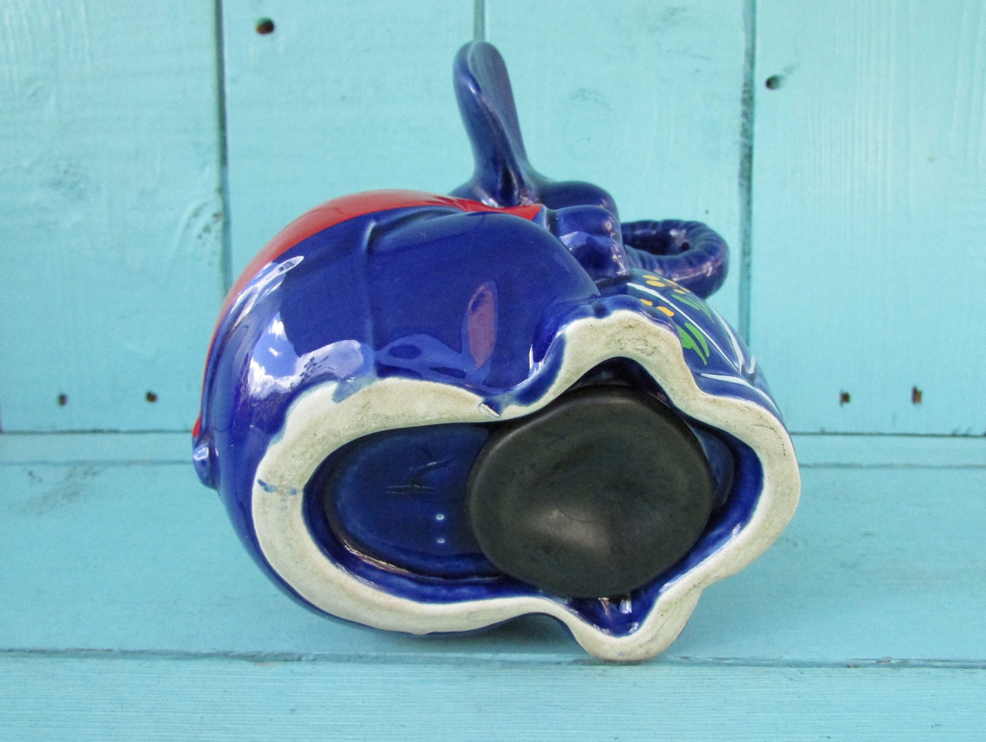Vintage hand-painted blue ceramic elephant, with drum & googly eyes, money box