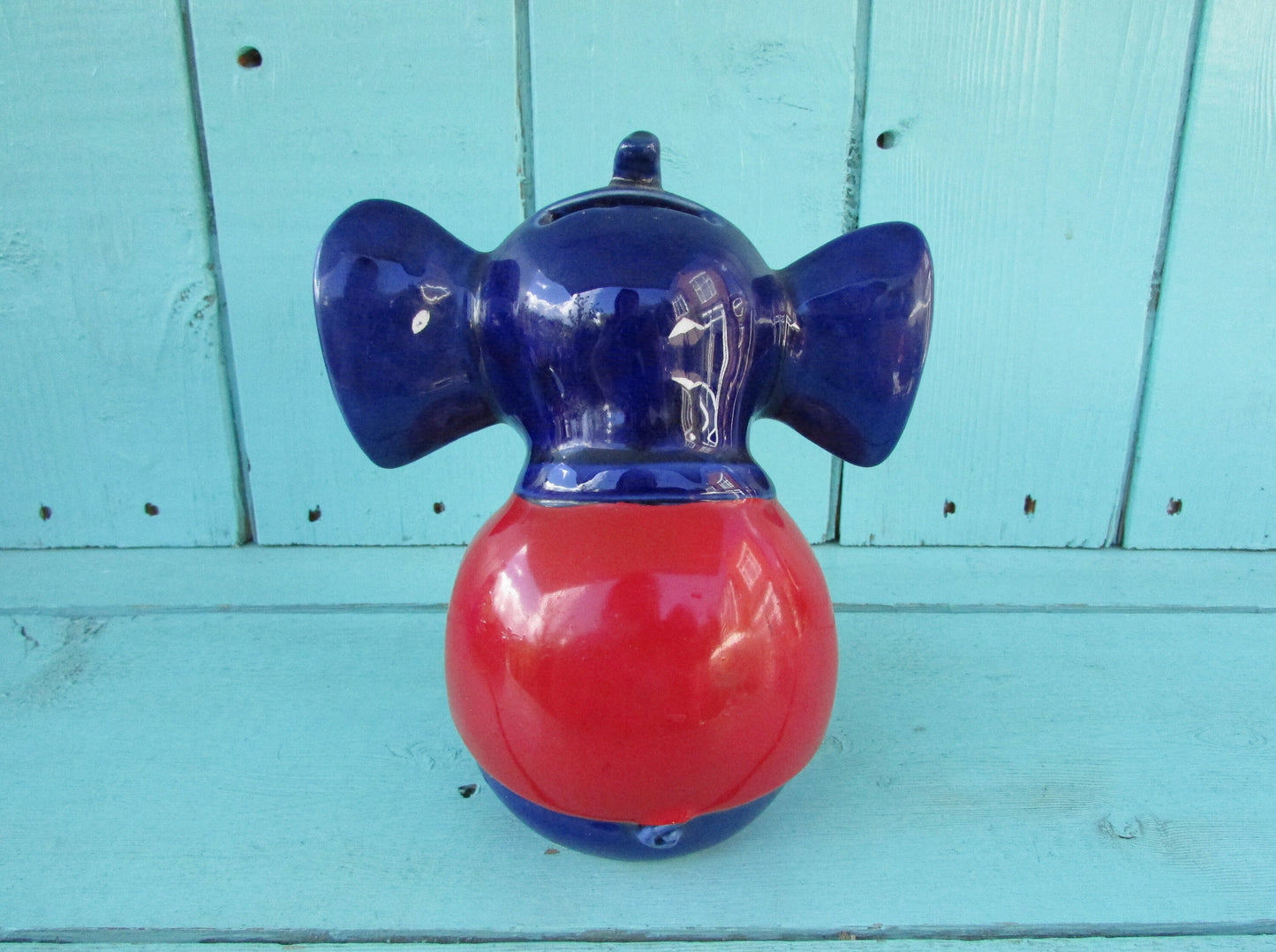Vintage hand-painted blue ceramic elephant, with drum & googly eyes, money box