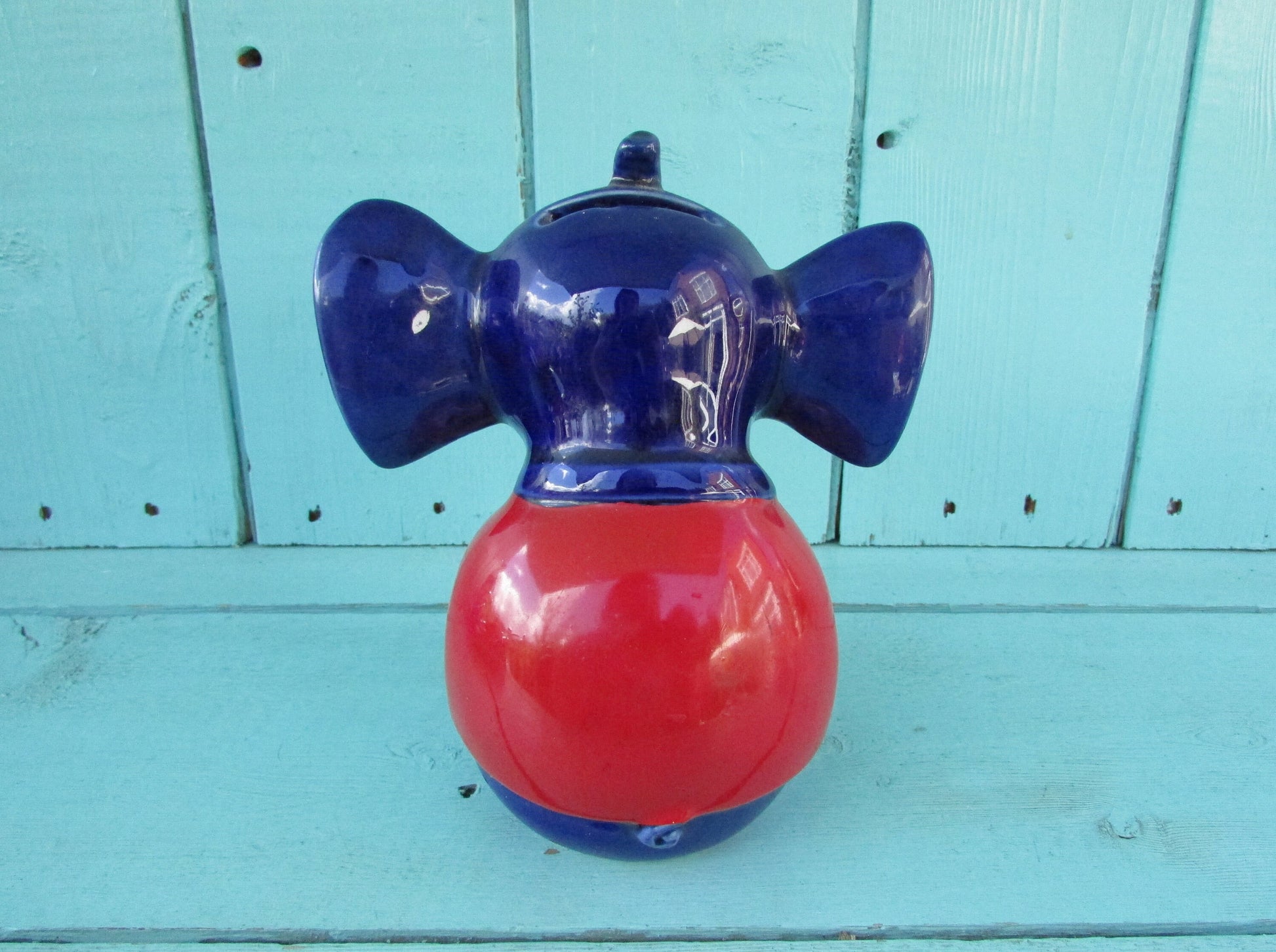 Vintage hand-painted blue ceramic elephant, with drum & googly eyes, money box
