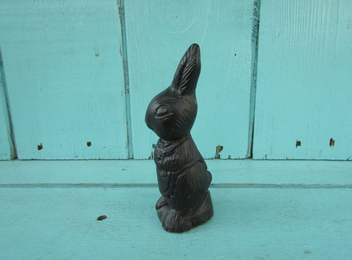 Vintage miniature coal rabbit figurine wearing apron