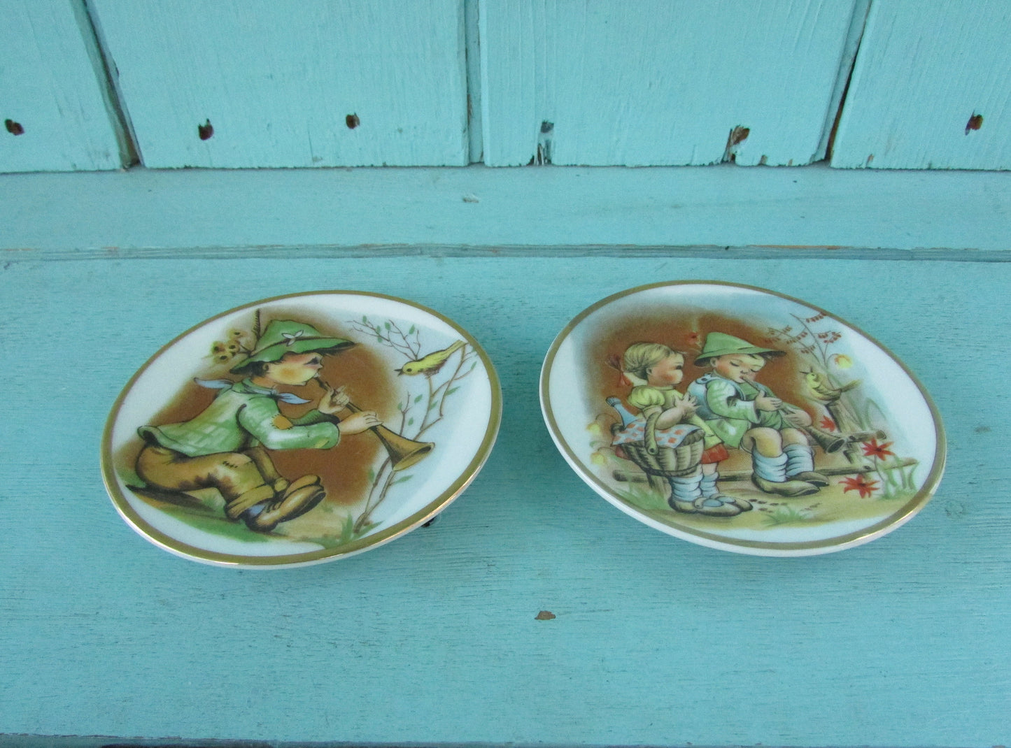 Pair of cute vintage Heidi & Peter miniature art plates with gilt edging