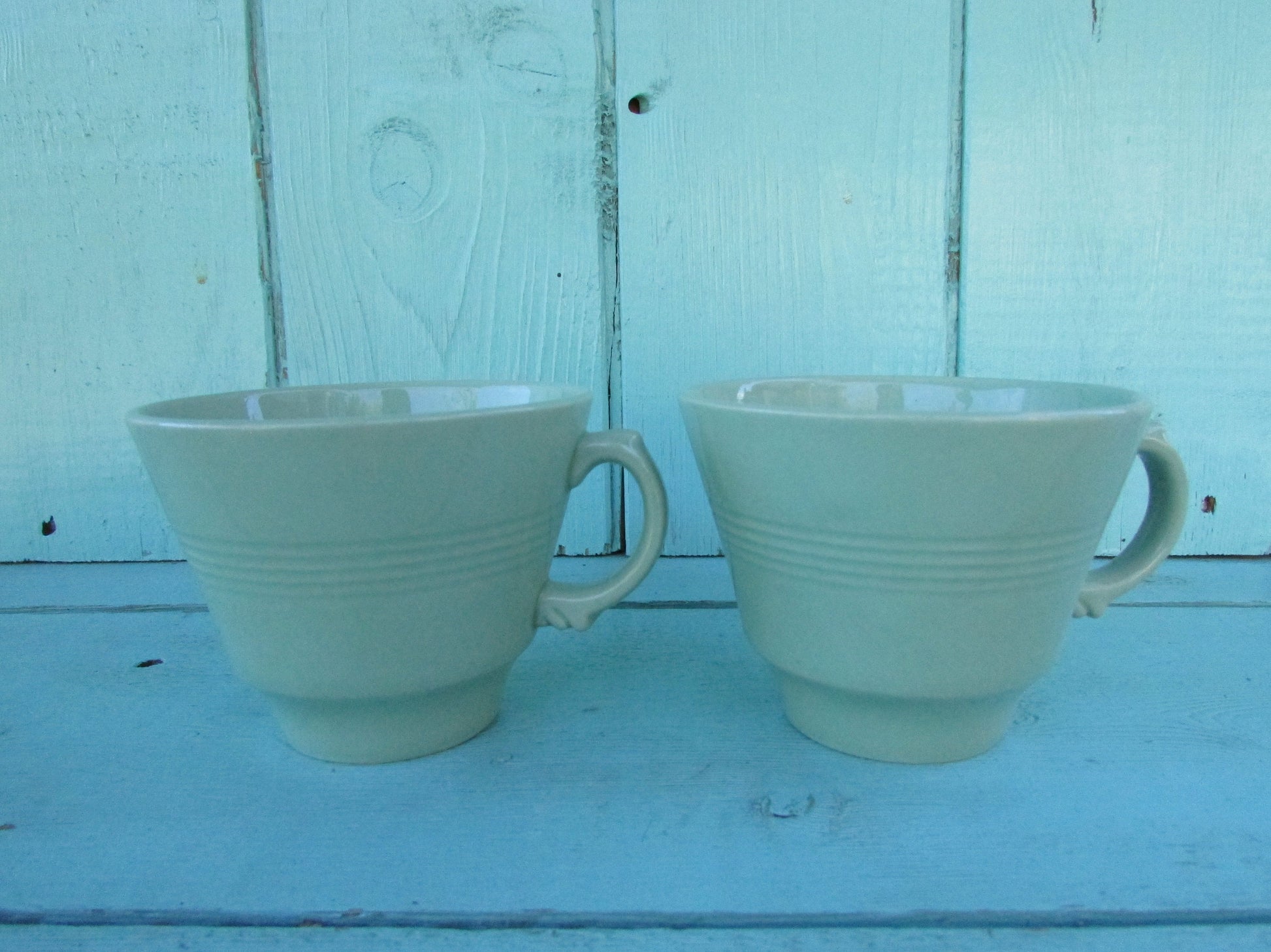 Two 1940s Wood's Ware Beryl green teacups and saucers