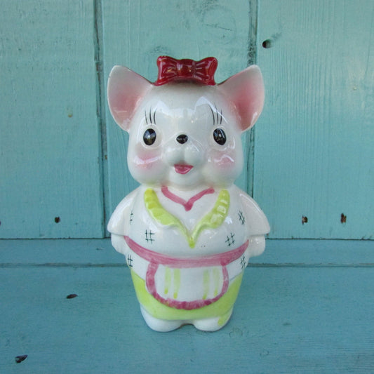 Vintage ceramic dog money box, with red hair bow detail, marked Foreign