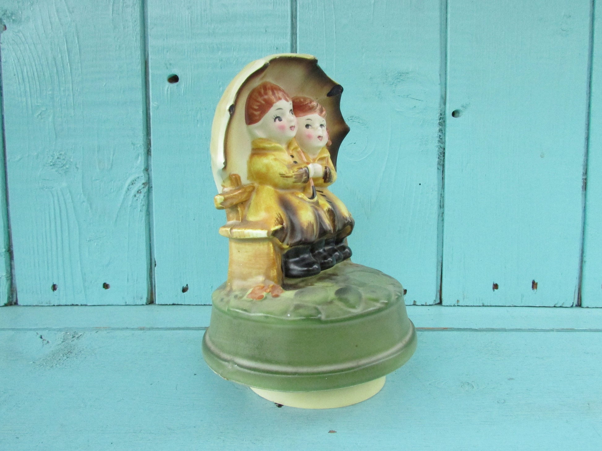 1970s Sankyo Japan ceramic musical ornament, children under umbrella