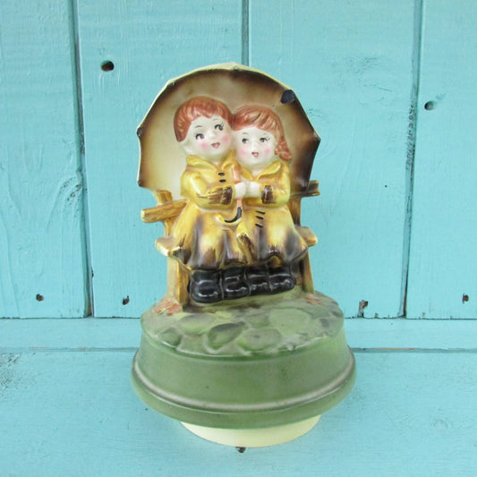 1970s Sankyo Japan ceramic musical ornament, children under umbrella