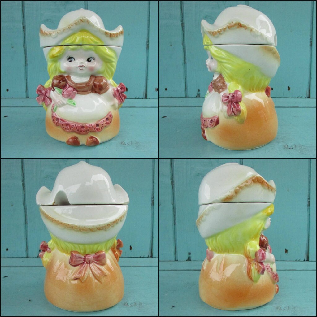 Pair of vintage ceramic Dutch girls in traditional costume lidded milk jug & sugar pot