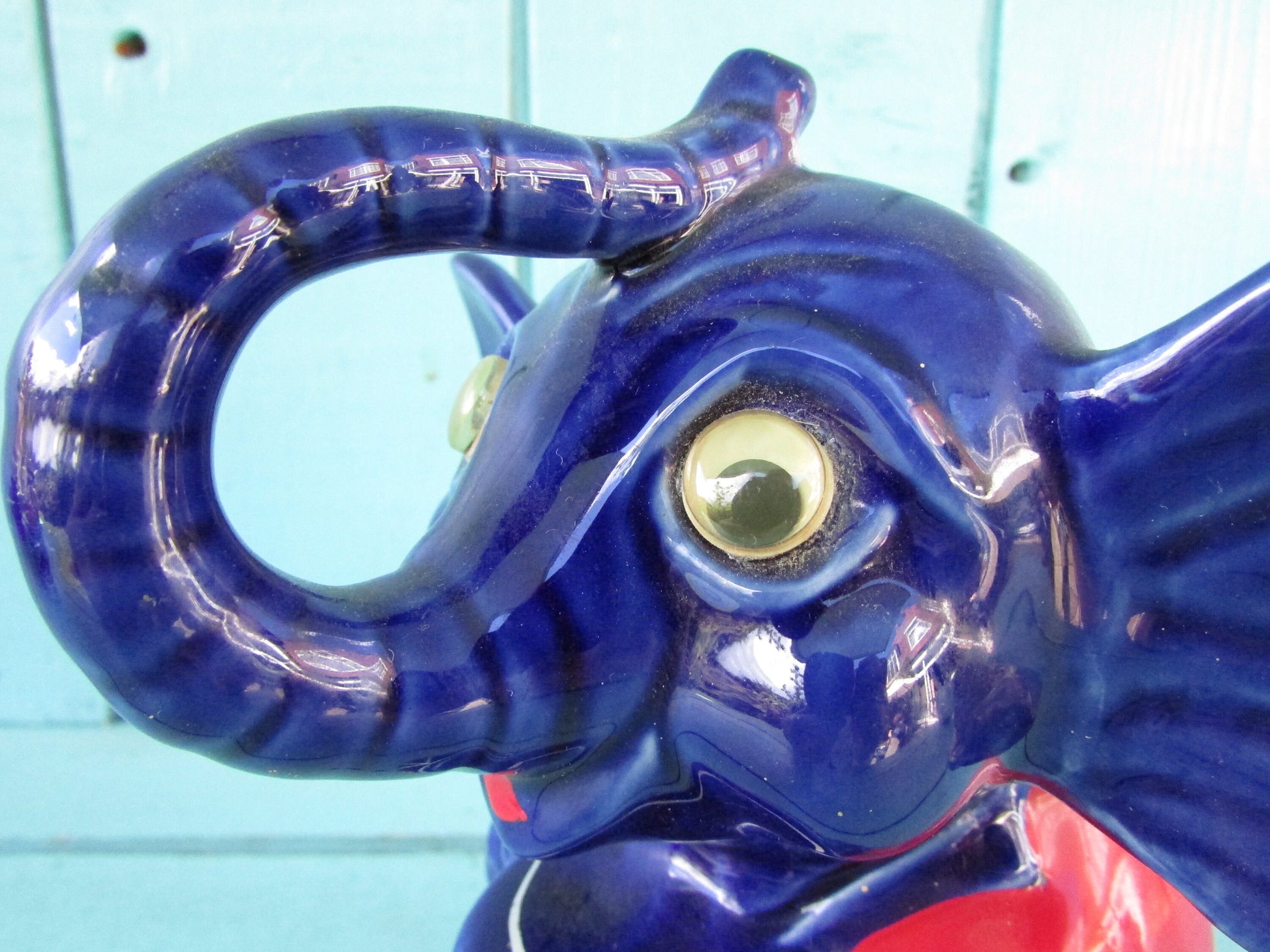 Vintage hand-painted blue ceramic elephant, with drum & googly eyes, money box