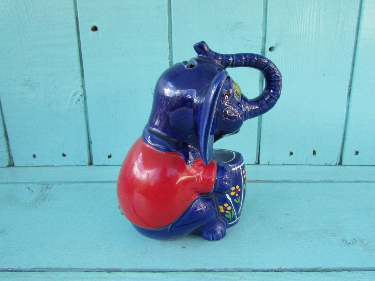 Vintage hand-painted blue ceramic elephant, with drum & googly eyes, money box