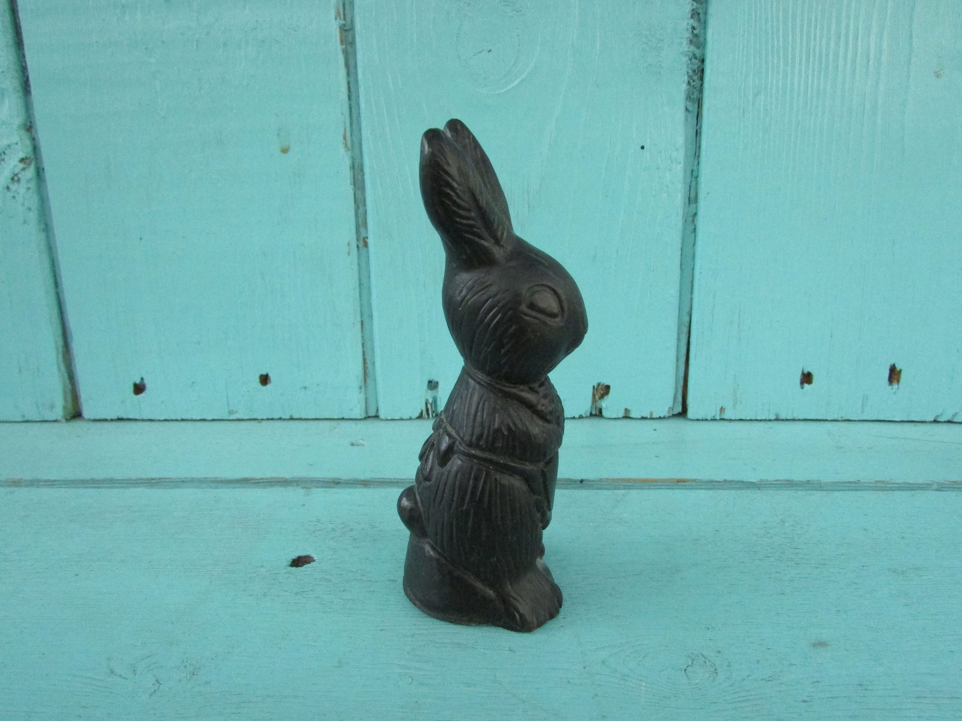 Vintage miniature coal rabbit figurine wearing apron