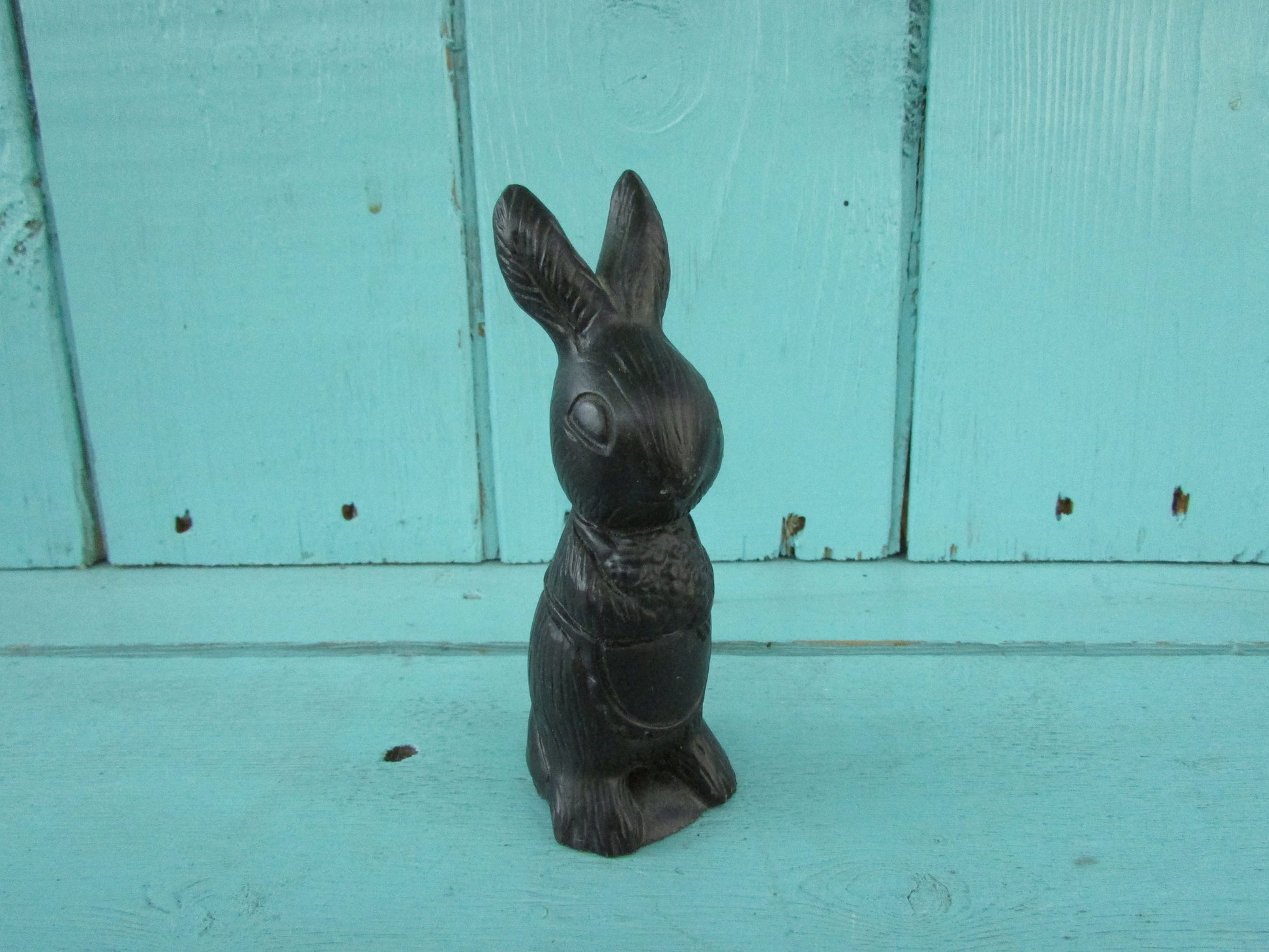 Vintage miniature coal rabbit figurine wearing apron
