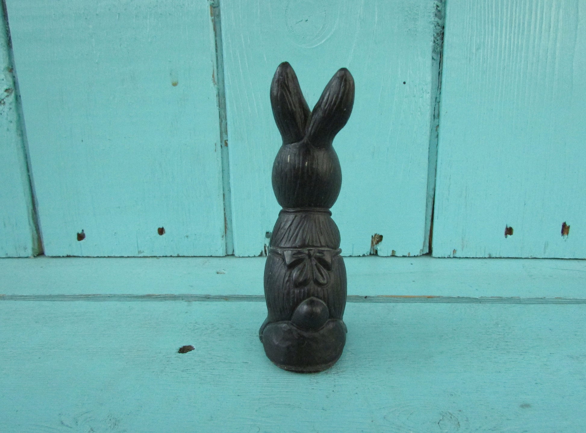 Vintage miniature coal rabbit figurine wearing apron
