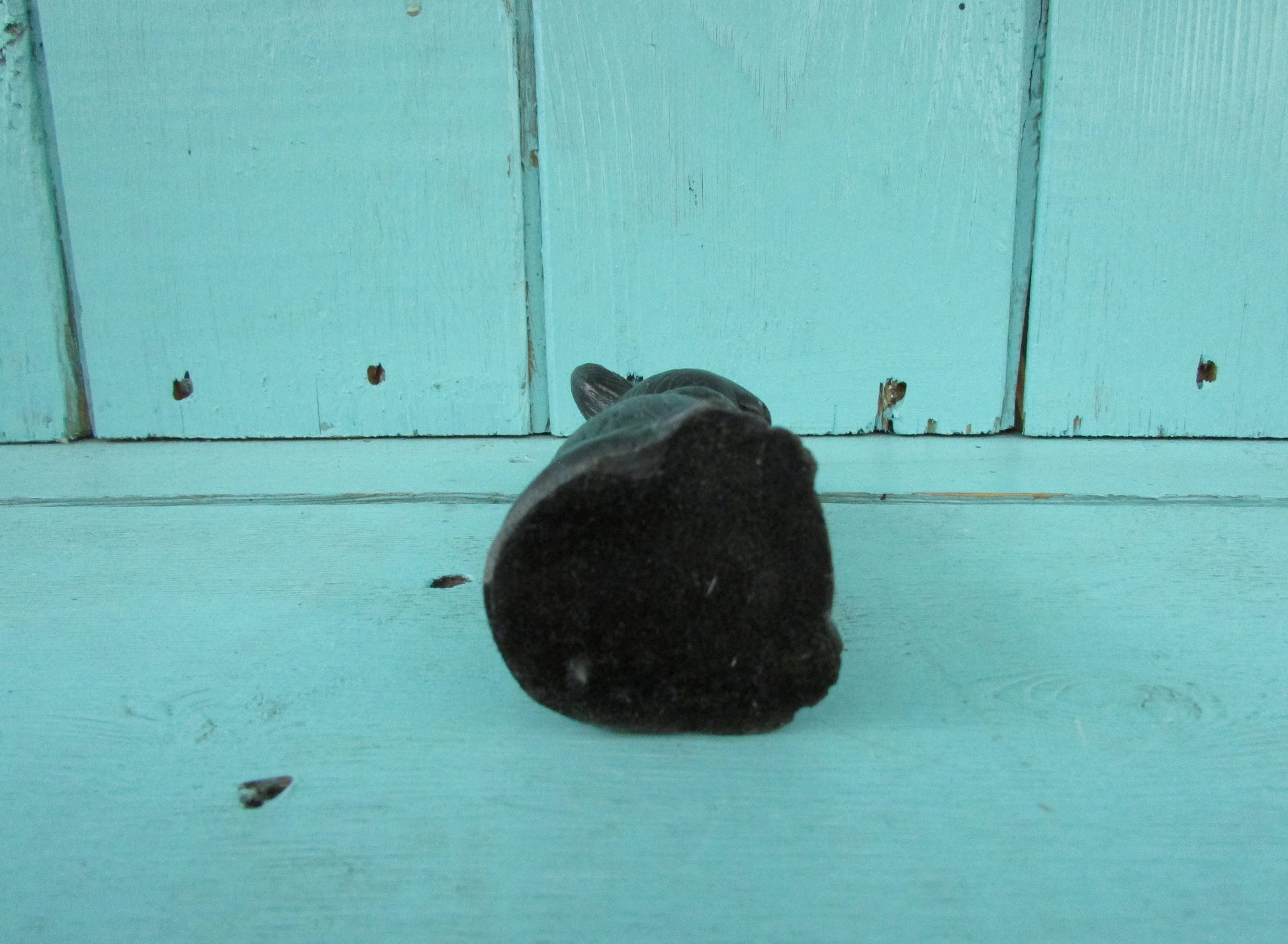 Vintage miniature coal rabbit figurine wearing apron