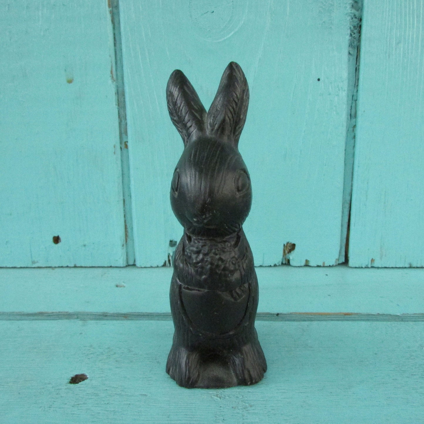 Vintage miniature coal rabbit figurine wearing apron