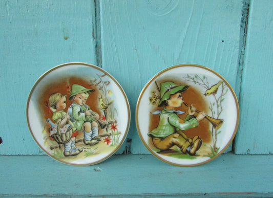 Pair of cute vintage Heidi & Peter miniature art plates with gilt edging