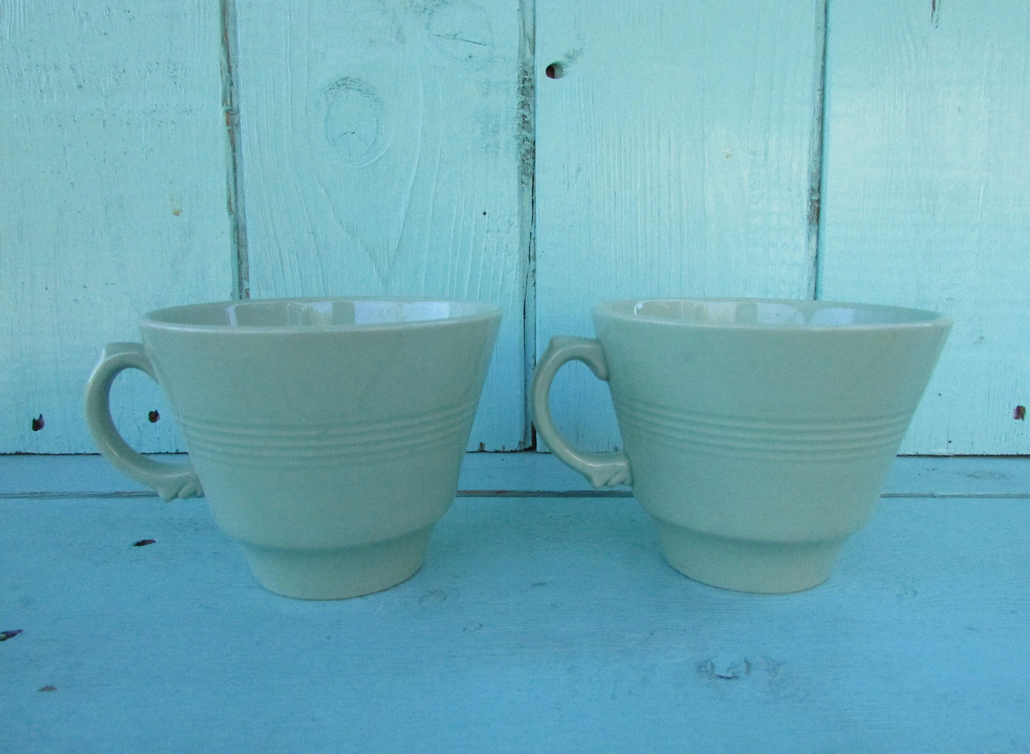 Two 1940s Wood's Ware Beryl green teacups and saucers