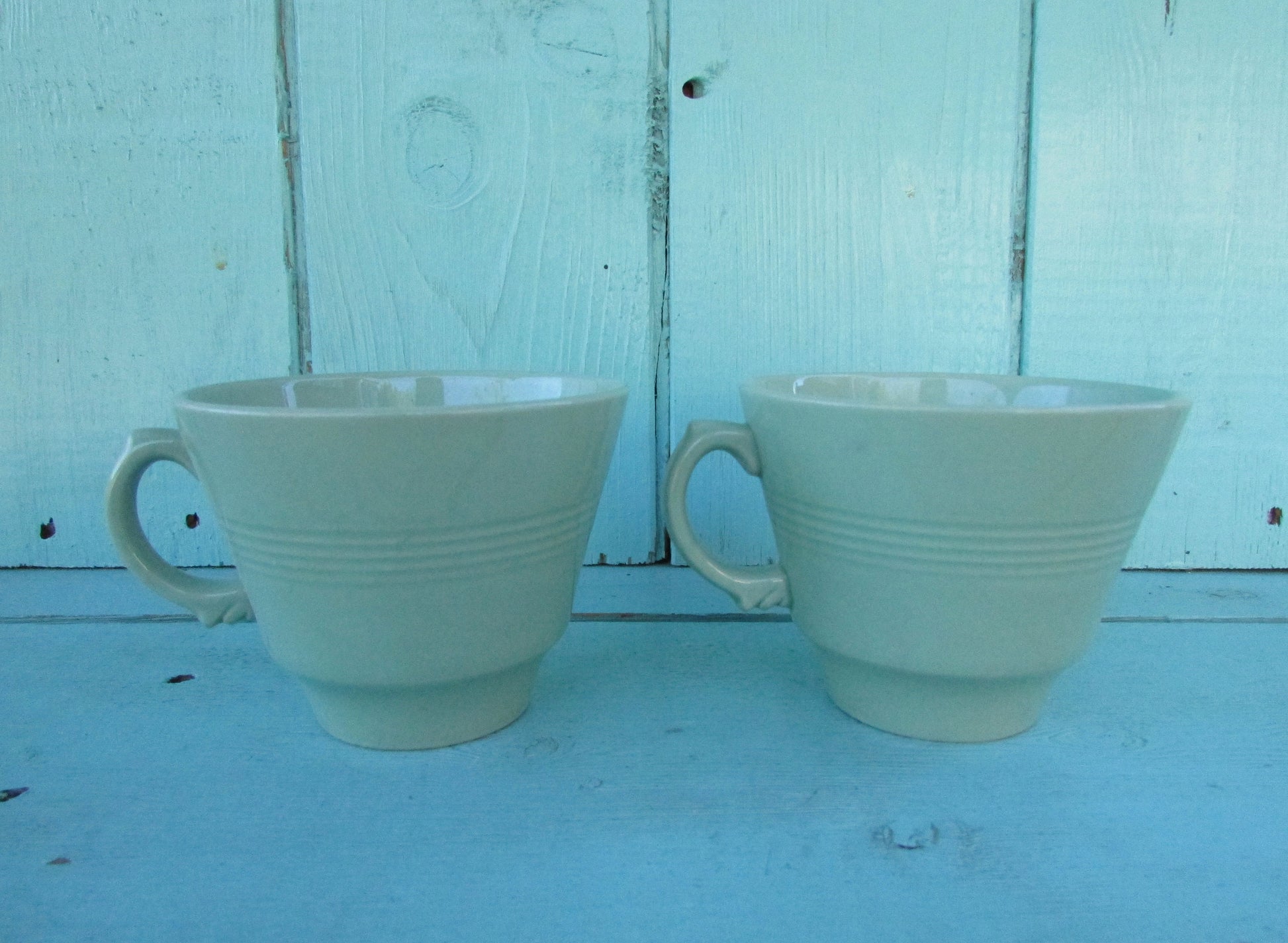 Two 1940s Wood's Ware Beryl green teacups and saucers