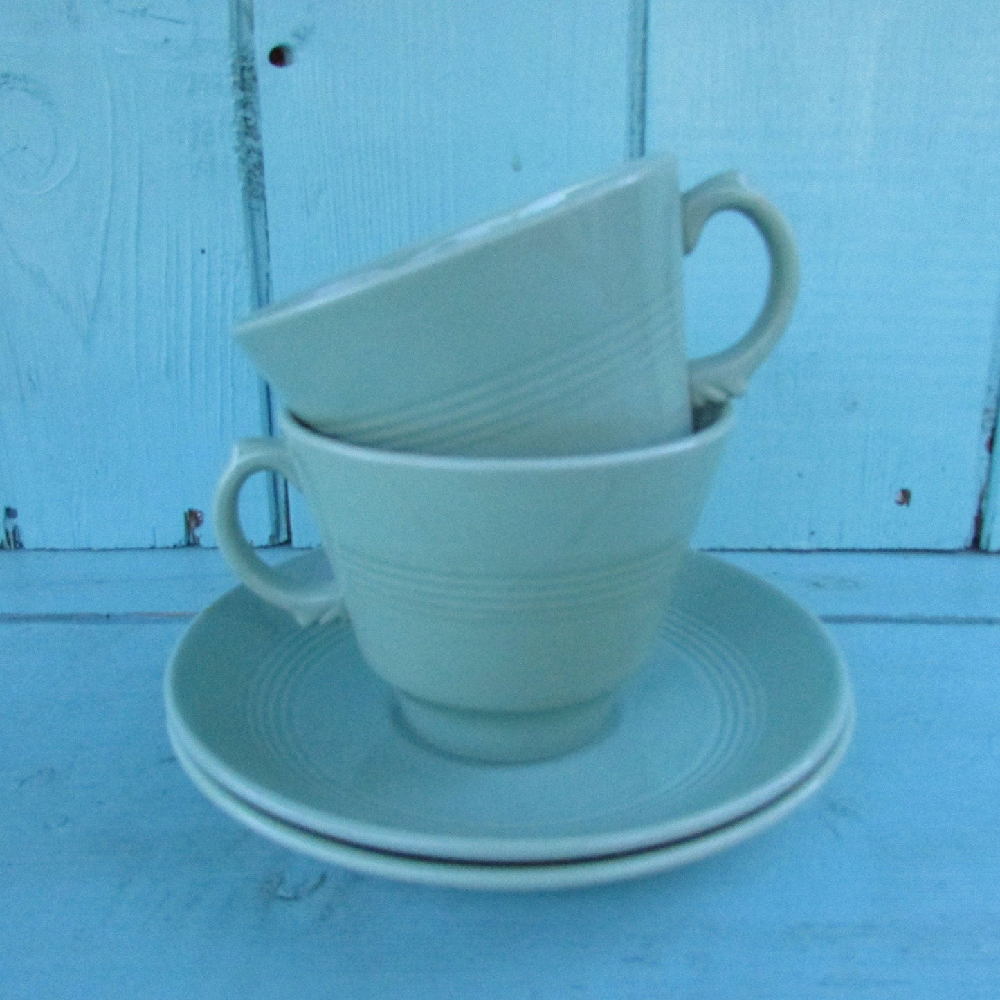 Two 1940s Wood's Ware Beryl green teacups and saucers