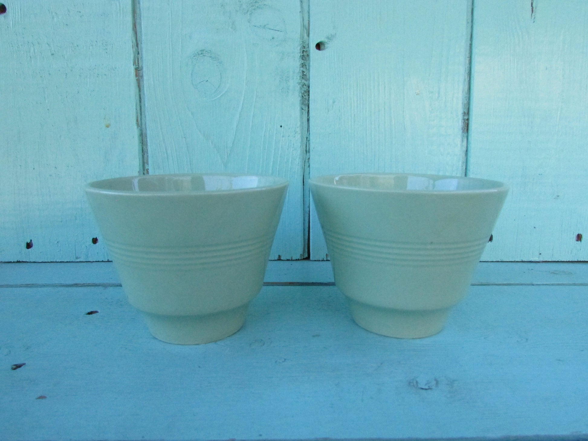 Two 1940s Wood's Ware Beryl green teacups and saucers