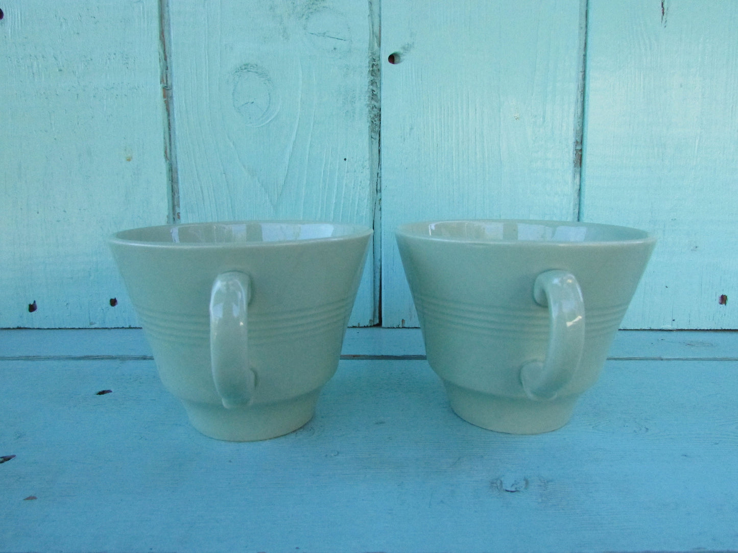 Two 1940s Wood's Ware Beryl green teacups and saucers