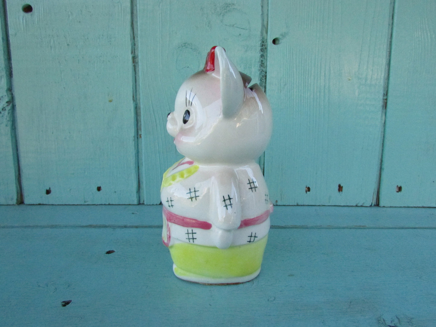 Vintage ceramic dog money box, with red hair bow detail, marked Foreign