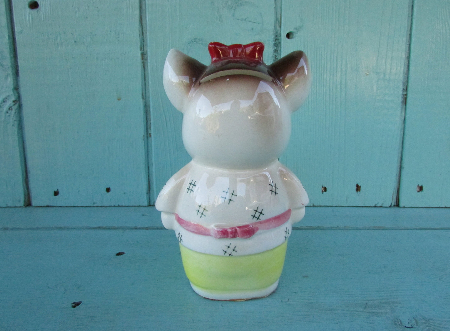 Vintage ceramic dog money box, with red hair bow detail, marked Foreign