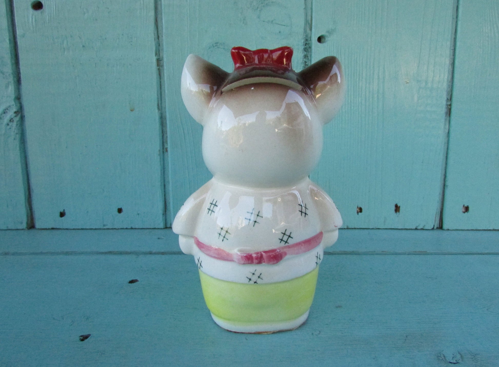 Vintage ceramic dog money box, with red hair bow detail, marked Foreign