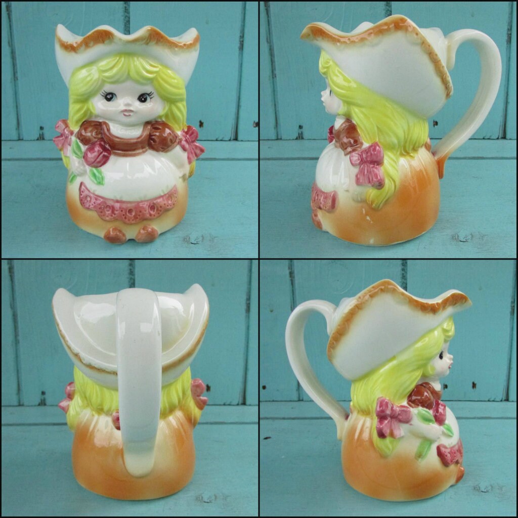 Pair of vintage ceramic Dutch girls in traditional costume lidded milk jug & sugar pot